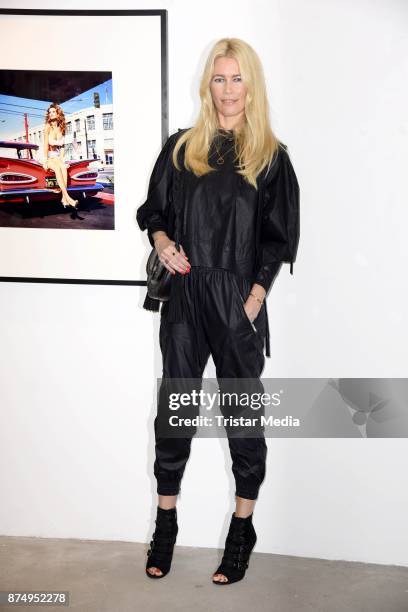 Model Claudia Schiffer signs the photo book 'Claudia Schiffer' at CWC Gallery on November 16, 2017 in Berlin, Germany.