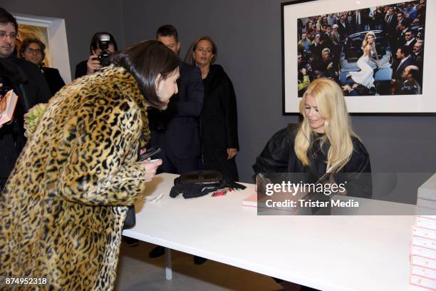 Model Claudia Schiffer signs the photo book 'Claudia Schiffer' at CWC Gallery on November 16, 2017 in Berlin, Germany.