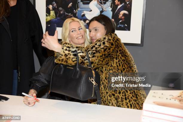 Model Claudia Schiffer signs the photo book 'Claudia Schiffer' at CWC Gallery on November 16, 2017 in Berlin, Germany.