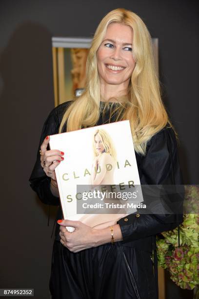 Model Claudia Schiffer signs the photo book 'Claudia Schiffer' at CWC Gallery on November 16, 2017 in Berlin, Germany.