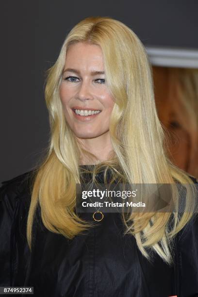 Model Claudia Schiffer signs the photo book 'Claudia Schiffer' at CWC Gallery on November 16, 2017 in Berlin, Germany.