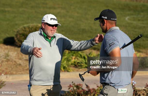 Jonathan Thomson of England is congratulated by his father after earning his card during the final round of the European Tour Qualifying School Final...