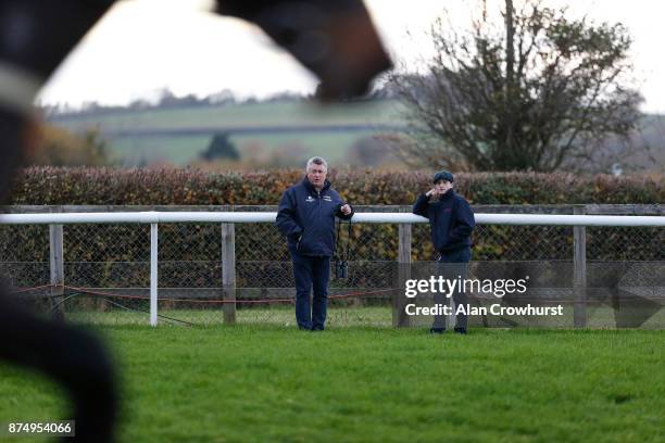 Trainer Paul Nicholls with his assistant trainer Harry Derham watching the action at Taunton racecourse on November 16, 2017 in Taunton, United...