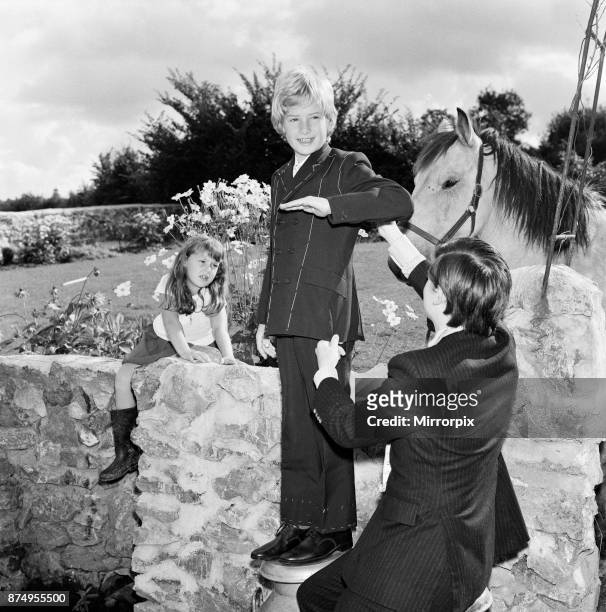 Child film star Mark Lester, 10 years old, being fitted for the suit which he will wear when being presented to Princess Margaret at the London film...