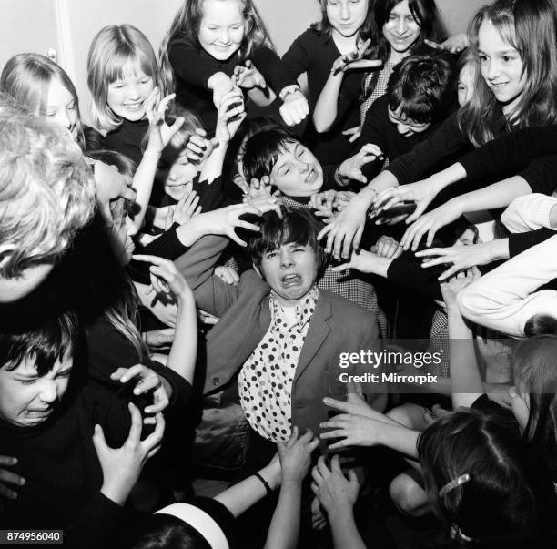 Actor Jack Wild who played the role of the Artful Dodger in the 1968 Lionel Bart musical film Oliver! Pictured messing around with other young...