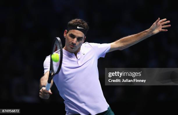 Roger Federer of Switzerland plays a backhand in his Singles match against Marin Cilic of Croatia during day five of the Nitto ATP World Tour Finals...