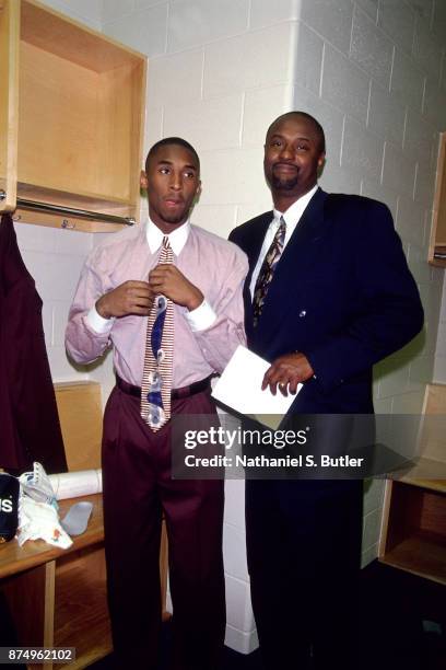 Kobe Bryant of the Los Angeles Lakers and his dad Joe Bryant pose in the locker during a game played on November 26, 1996 at the First Union Arena in...