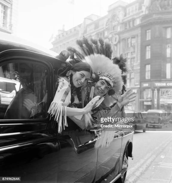 Couple of actors dressed as an Indian Chief and his Squaw, pictured leaving New Zealand House after press conference, 23rd September 1965. They are...