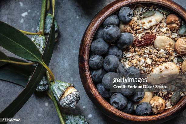almond and amaranth granola with blueberries close up - haferflocken stock-fotos und bilder
