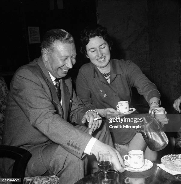George Formby and fiancee Pat Howsen of Preston. She is wearing the huge solitaire diamond ring on her engagement finger. George is wearing his usual...