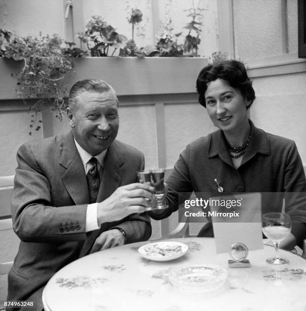 George Formby and fiancee Pat Howsen of Preston. She is wearing the huge solitaire diamond ring on her engagement finger. George is wearing his usual...