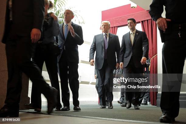 President Donald Trump and Speaker of the House Paul Ryan leave a House Republican conference meeting at the U.S. Capitol November 16, 2017 in...