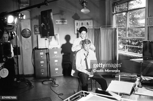 Actor Michael Caine pictured during the shooting of the film Alfie at the Old Royal Victoria Hospital. Also pictured in the filming scenes are...