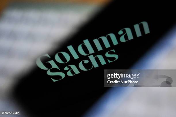 The Goldman Sachs bank logo is seen reflected on the screen of a mobile phone in this photo illustration on November 15, 2017.
