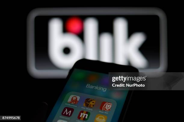 Smartphone with banking applications is seen with the Blik mobile payments logo in the background in this photo illustration on November 15, 2017....