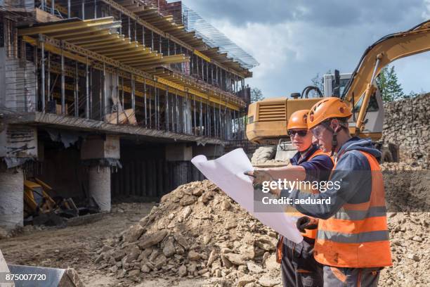 workers on construction site - geotechnical-engineering stock pictures, royalty-free photos & images
