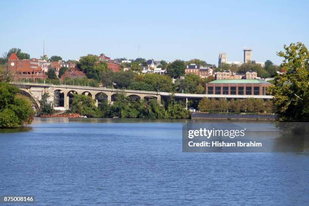 skyline of georgetown and freeway from the potomac river, georgetown, washington dc - potomac river fotografías e imágenes de stock