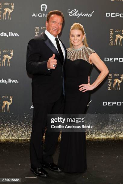 Arnold Schwarzenegger and his partner Heather Milligan arrive at the Bambi Awards 2017 at Stage Theater on November 16, 2017 in Berlin, Germany.