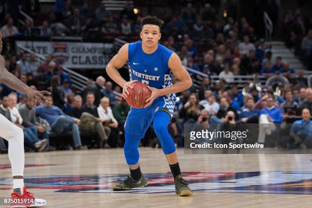 Kentucky Wildcats forward Kevin Knox looks for a teammate to pass to during the State Farm Champions Classic basketball game between the Kansas...