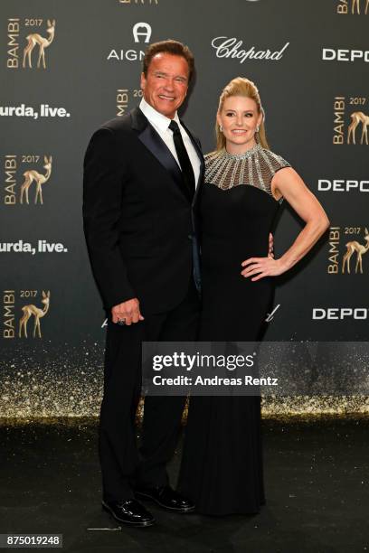 Arnold Schwarzenegger and his partner Heather Milligan arrive at the Bambi Awards 2017 at Stage Theater on November 16, 2017 in Berlin, Germany.