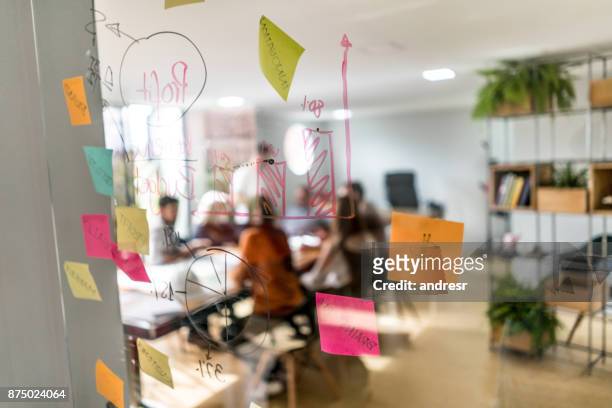 group of people in a business meeting at a creative office - brainstorming stock pictures, royalty-free photos & images