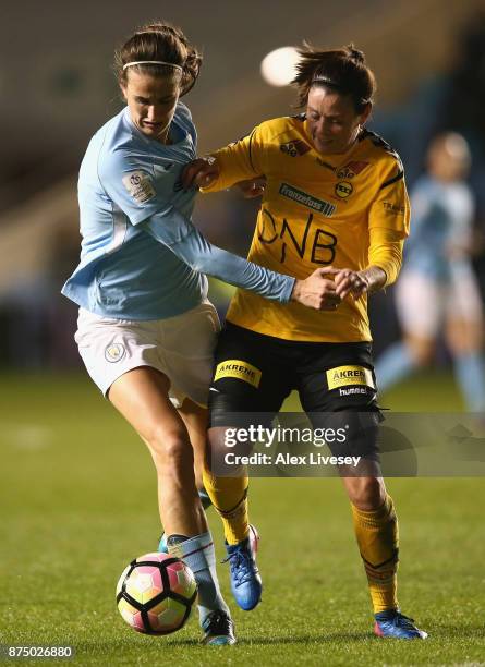 Jill Scott of Manchester City Women holds off a challenge from Isabell Bachor of LSK Kvinner during the UEFA Women's Champions League match between...