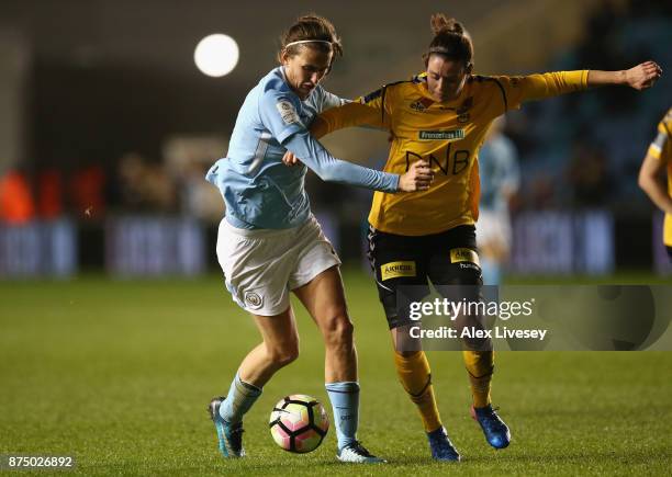 Jill Scott of Manchester City Women holds off a challenge from Isabell Bachor of LSK Kvinner during the UEFA Women's Champions League match between...