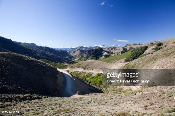 discovering argentina - seven lakes road (ruta de los siete lagos) in northern patagonia - argentina dirt road panorama stock pictures, royalty-free photos & images