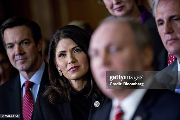 Representative Kristi Noem, a Republican from South Dakota, second left, listens during a news conference with House Republican members after voting...