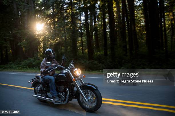 motorcyclist peace sign on the road - yellow motorcycle stock pictures, royalty-free photos & images