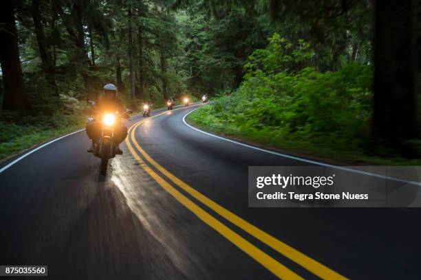 motorcycle club on country road - motorcycle gang stock-fotos und bilder