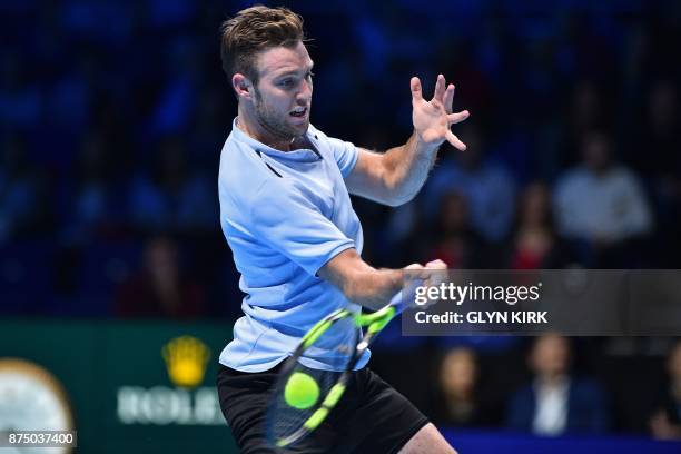 Player Jack Sock returns to Germany's Alexander Zverev during their men's singles round-robin match on day five of the ATP World Tour Finals tennis...