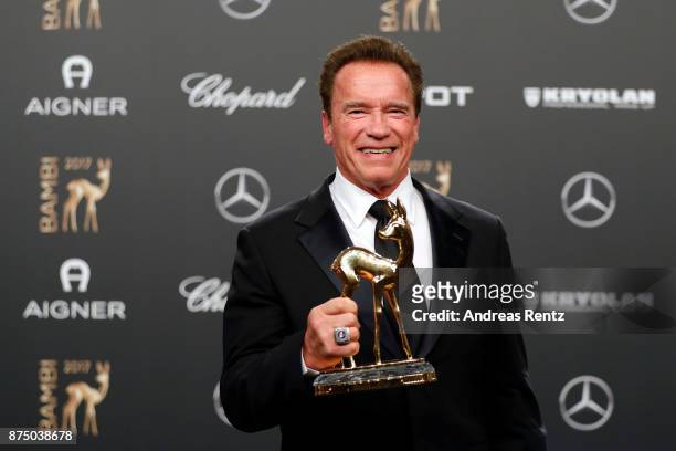 Arnold Schwarzenegger poses with award at the Bambi Awards 2017 winners board at Stage Theater on November 16, 2017 in Berlin, Germany.