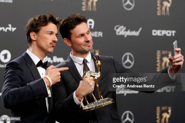 Florian David Fitz and Simon Verhoeven pose with award at the Bambi Awards 2017 winners board at Stage Theater on November 16, 2017 in Berlin,...