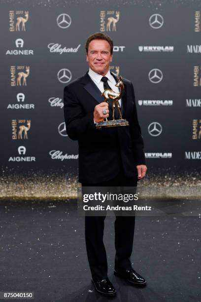 Arnold Schwarzenegger poses with award at the Bambi Awards 2017 winners board at Stage Theater on November 16, 2017 in Berlin, Germany.