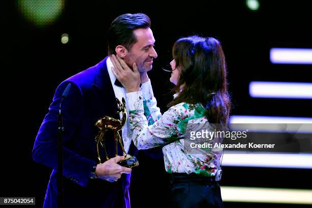 Hugh Jackman and Iris Berben on stage during the Bambi Awards 2017 show at Stage Theater on November 16, 2017 in Berlin, Germany.