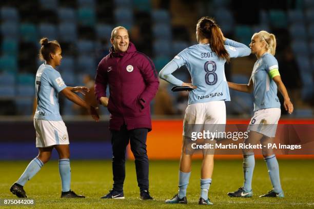 Manchester City manager Nick Cushing celebrates with Manchester City players after the final whistle during the UEFA Women's Champions League match...