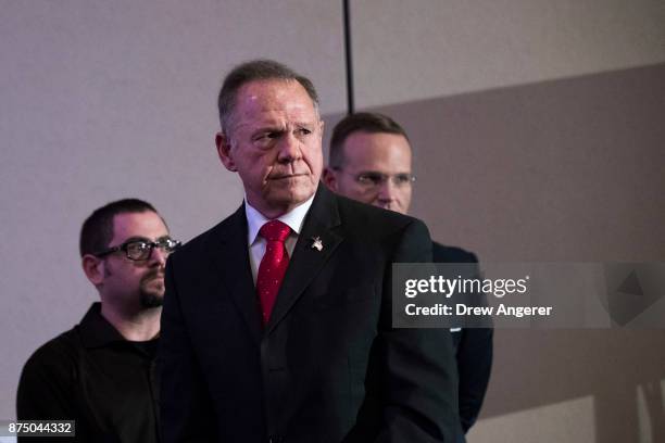 Republican candidate for U.S. Senate Judge Roy Moore listens to a question during a news conference with supporters and faith leaders, November 16,...