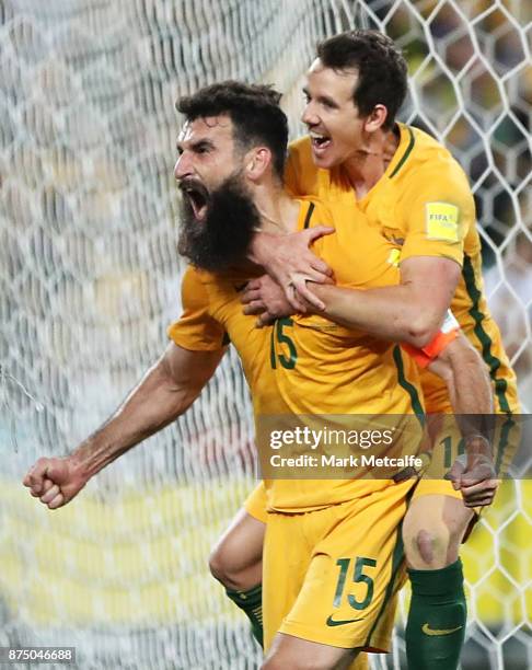 Mile Jedinak of Australia celebrates scoring a goal during the 2018 FIFA World Cup Qualifiers Leg 2 match between the Australian Socceroos and...