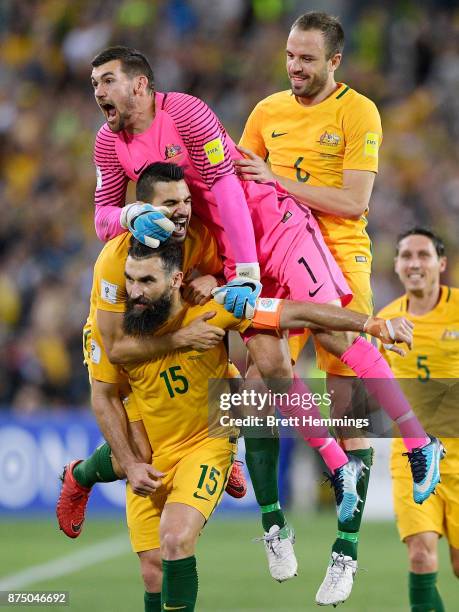 Mile Jedinak of Australia celebrates scoring a goal with team mates during the 2018 FIFA World Cup Qualifiers Leg 2 match between the Australian...