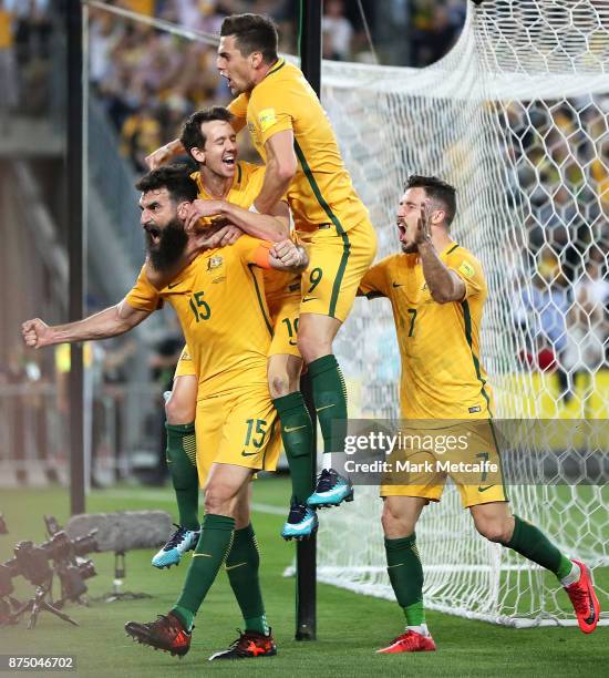 Mile Jedinak of Australia celebrates with team mates after scoring a goal during the 2018 FIFA World Cup Qualifiers Leg 2 match between the...