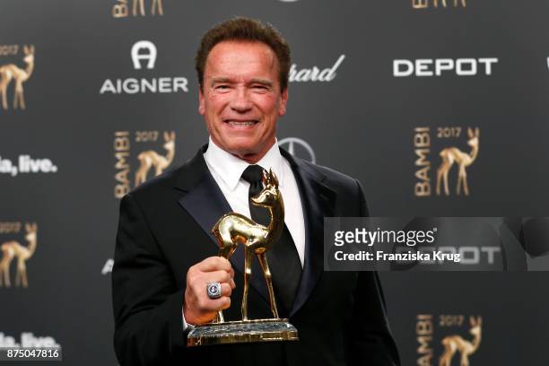 Arnold Schwarzenegger poses with an award at the Bambi Awards 2017 winners board at Stage Theater on November 16, 2017 in Berlin, Germany.