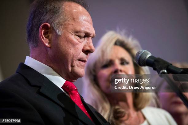 Republican candidate for U.S. Senate Judge Roy Moore speaks as his wife Kayla Moore looks on during a news conference with supporters and faith...