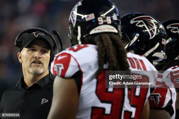 Head coach Dan Quinn of the Atlanta Falcons looks on before a game against the New England Patriots at Gillette Stadium on October 22, 2017 in...