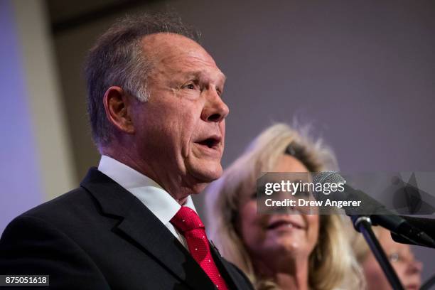 Republican candidate for U.S. Senate Judge Roy Moore speaks as his wife Kayla Moore looks on during a news conference with supporters and faith...