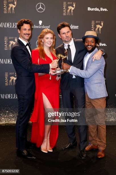 National Film' Award Winners Florian David Fitz, Palina Rojisnki, Simon Verhoeven and Eric Kabongo pose at the Bambi Awards 2017 winners board at...