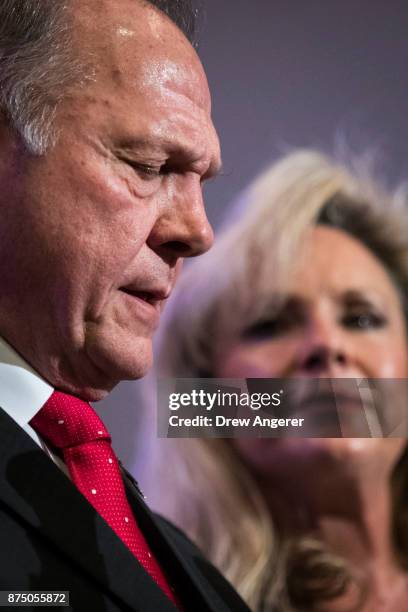 Republican candidate for U.S. Senate Judge Roy Moore speaks as his wife Kayla Moore looks on during a news conference with supporters and faith...