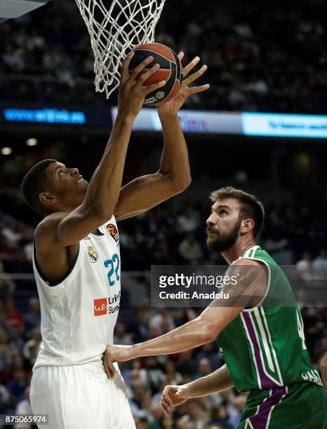 Edy Tavares of Real Madrid in action against Dejan Musli of Unicaja Malaga during the Turkish Airlines Euroleague basketball match between Real...