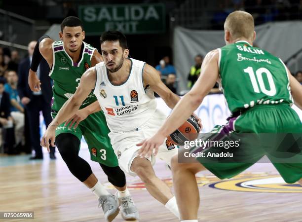 Facundo Campazzo of Real Madrid in action against Ray McCallum and Sasu Salin of Unicaja Malaga during the Turkish Airlines Euroleague basketball...