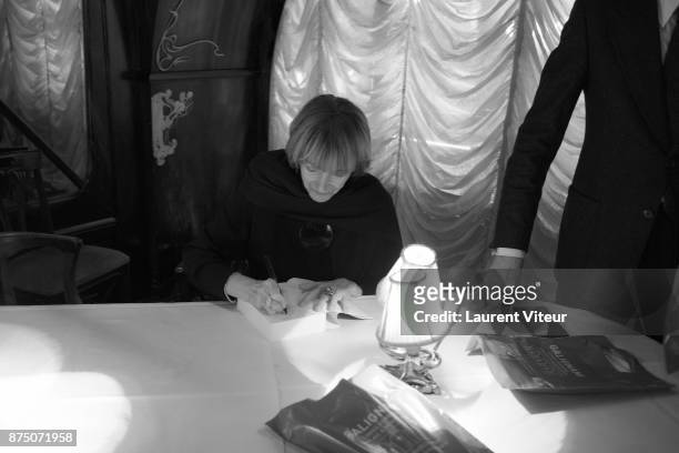 Eve Ruggieri sign copies of her book "Dictionnaire Amoureux de Mozart" at Maxim's on November 16, 2017 in Paris, France.